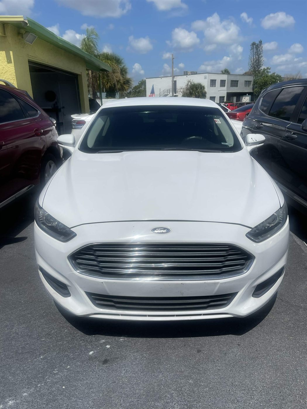 2016 Ford Fusion SE sedan in white — front view